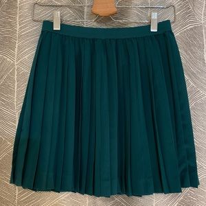 Green pleated mini skirt